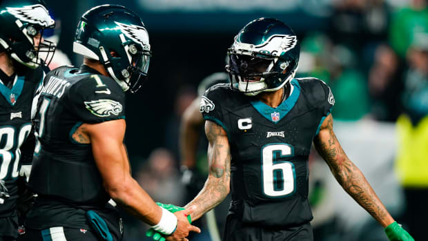 Eagles wide receiver DeVonta Smith, right, celebrates after scoring with quarterback Jalen Hurts on Christmas Day 2023